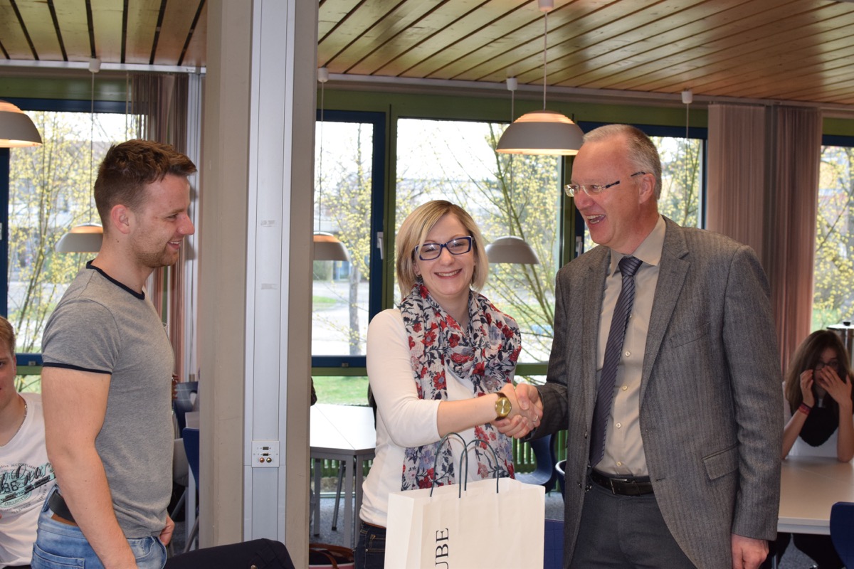 Mr Grünewald shaking hands with Petra Uhlirova and Patrik Matejsek...
